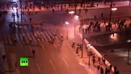 Tear gas flares stones Protest raging in Athens against