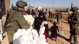 Russian military police deliver humanitarian aid in Syrias Dali Far