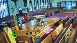 Caught on CCTV Woman knocks 15 foot crucifix in California church