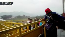 Chaos at Simon Bolivar Bridge Venezuelans storm the border to Colombia