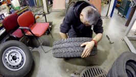 Repairing tubeless tire with patch and balancing set of wheels with steel rims.