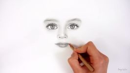 Drawing realistic eyesnose and lips of a child with graphite pencils