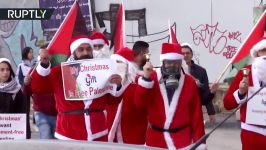 RAW ‘Santa Claus’ protest over West Bank separation barrier in Bethlehem