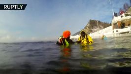 Underwater fun Divers swim around New Year tree in Lake Baikal