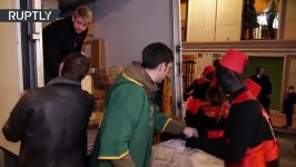 Spanish teenagers don blackface and hand out gifts to children in parade