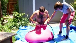 6ft Man in 6ft Giant Water Balloon  4K  The Slow Mo Guys