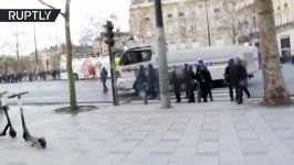 Police deploy water cannon during Yellow Vest protest in Paris