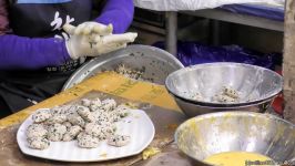 Korea Street Food in Hongdae Seoul. Cooking Pan Fried Pancakes