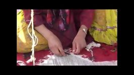 Qashqai woman is weaving kilim