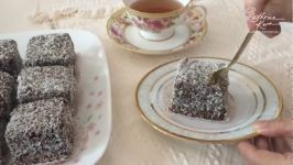 کیک اسفنجی ساده لایه گاناش شکلاتی روکش شکلات نارگیلLamingtons