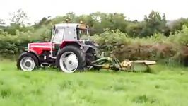 MF399 Cabbed Tractor Mowing Grass