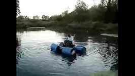 Redneck Jet Ski Lawnmower drives on water