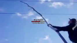 Stupid Dude Touches A Power Line With Stick