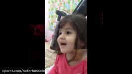 A small cute kid reciting the holy Quran Sura al Naas