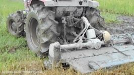 Tractor plowing rice paddy 2014