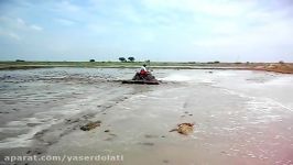 KUBOTA B2420 TRACTOR WITH LEVEL BLADE WORKING IN PADDY FILED IN BELLARY