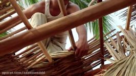 Tying the Royal Palm leaves to our Palapa roof