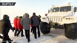 Putin grabs ice pick carves out shards from glacier in Arctic Russia