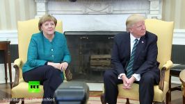 Awkward moment Trump ignores media prompts to shake hands with Merkel