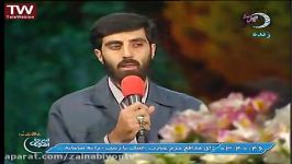 کربلایی رضا نریمانی در کنار پیکرشهید مدافع حرم مهدی اسحاقیان