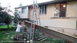 Using a pulley system to hoist a big steel beam for a sunroom