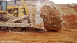 Caterpillar D11R pushing another massive rock