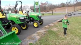 BOY LOVES JOHN DEERE TRACTOR DEALERSHIP