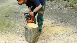 Chainsaw sculpture making a stool from a log