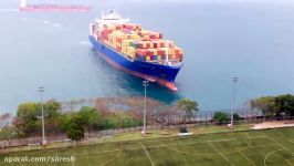 Container ship sails straight to shore by university football field