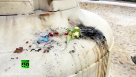 Fresh flowers laid atop ash at Hassanens DuPont Circle memorial