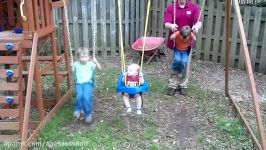 Boys learning how to pump a swing