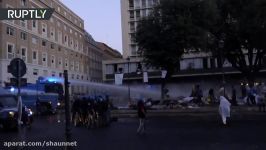 Rome police disperse rioting migrants with water cannons