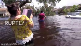 USA Bonita Springs residents wade home waist deep in water following Irma