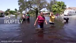 USA Bonita Springs residents wade home waist deep in water following Irma