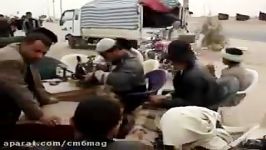 تعمیر کفش زوار امام حسین علیه السلام در مسیر پیاده روی اربعین
