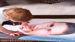 فیلم پسر شهید مدافع حرم هنگامی عکس پدر روبروشد خیلی غم انگیز