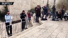 Israeli soldier violently rips scarf from neck of Palestinian kid