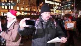 Santa Claus joins anti Trump protesters in NYC