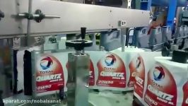 پرکن روغن درب گذار اتوماتیک در به توتالIndustrial oil filler with automatic