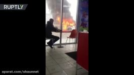 Food first then panic Guy chows down while bus is engulfed in flames