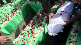 تدفین پیكر شهید گمنام دفاع مقدس توسط پدر شهید مدافع حرم
